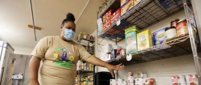 student browsing pantry shelf